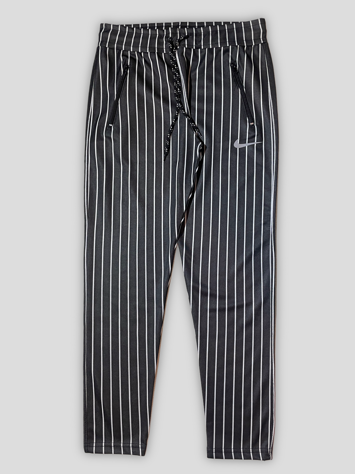 Black and White Striped Pants with Nike Swoosh Logo